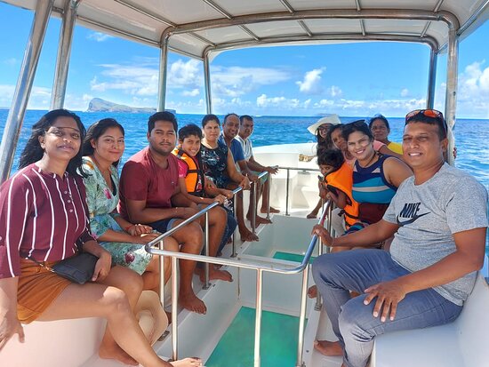 Tourists enjoying snorkeling and glass bottom boat ride at Blue Bay Marine Park, Mauritius