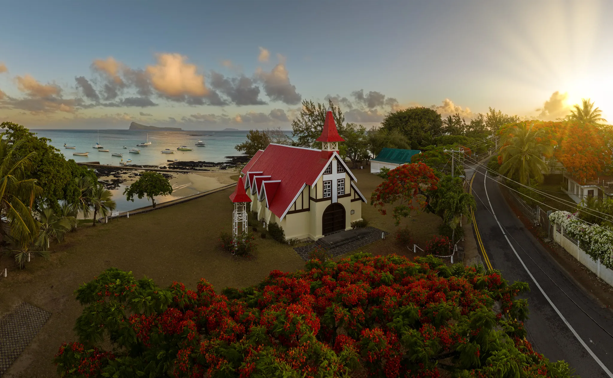 Red-roofed Notre-Dame Auxiliatrice Church by the sea at Cap Malheureux in Mauritius