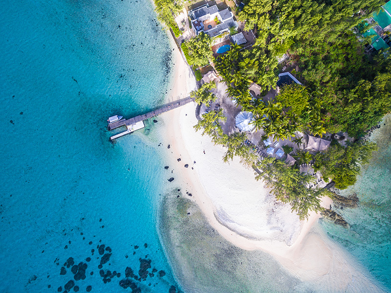 Aerial view of Île aux Cocos with white sandy beach and shallow turquoise waters in Rodrigues, Mauritius