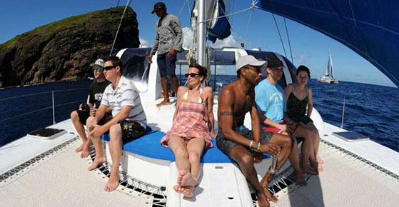 Guests enjoying drinks and food on catamaran to Gabriel Island, Mauritius