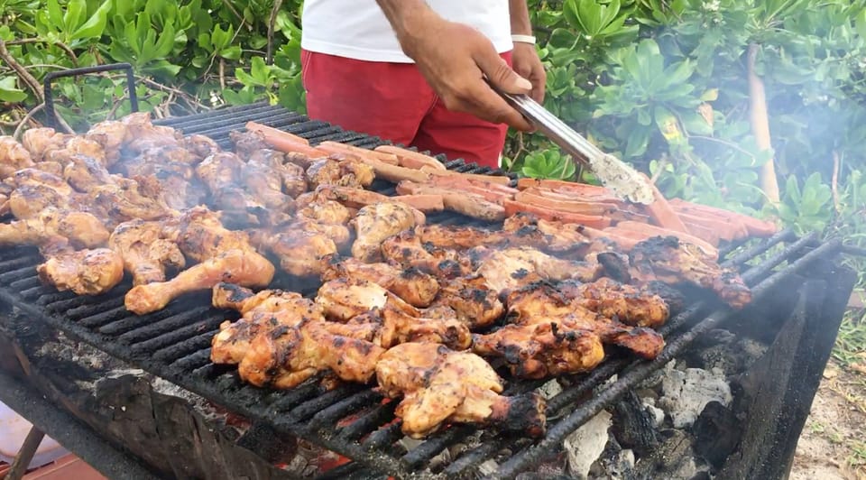 BBQ grilled chicken being prepared fresh for guests on Gabriel Island beach