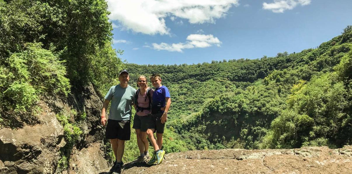 Tourists hiking along cliffs and trails near Tamarind Falls