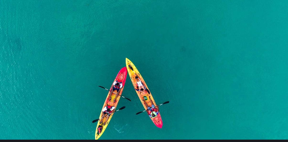 Top view of two kayaks in crystal-clear waters near Ambre Island