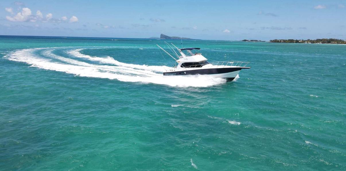 Speedboat for big game fishing gliding on turquoise waters of Mauritius