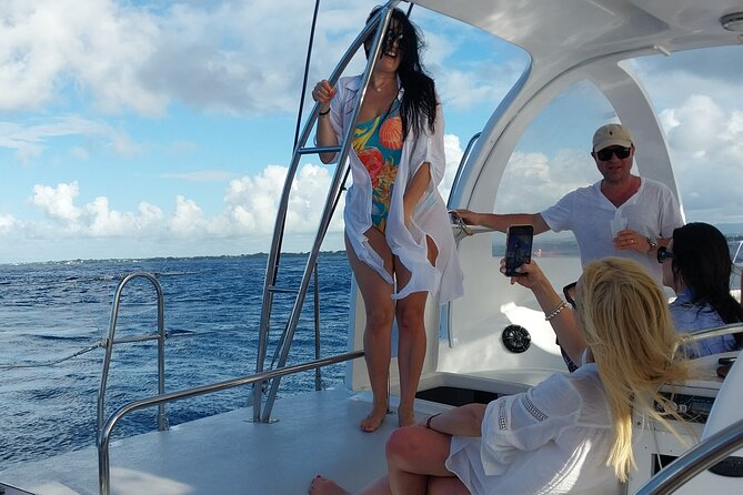 Woman enjoying a catamaran ride on the way to Gabriel Island, Mauritius